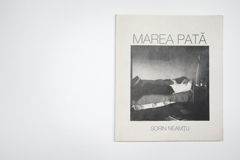 The cover of 'Marea Patã (The Great Blot)' by Sorin Neamțu features a black-and-white self-portrait photograph..